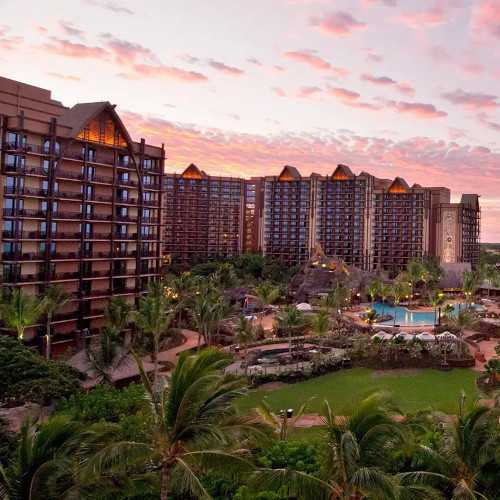 Aulani Disney Resort beach view with turquoise ocean, white sand, and tropical landscaping